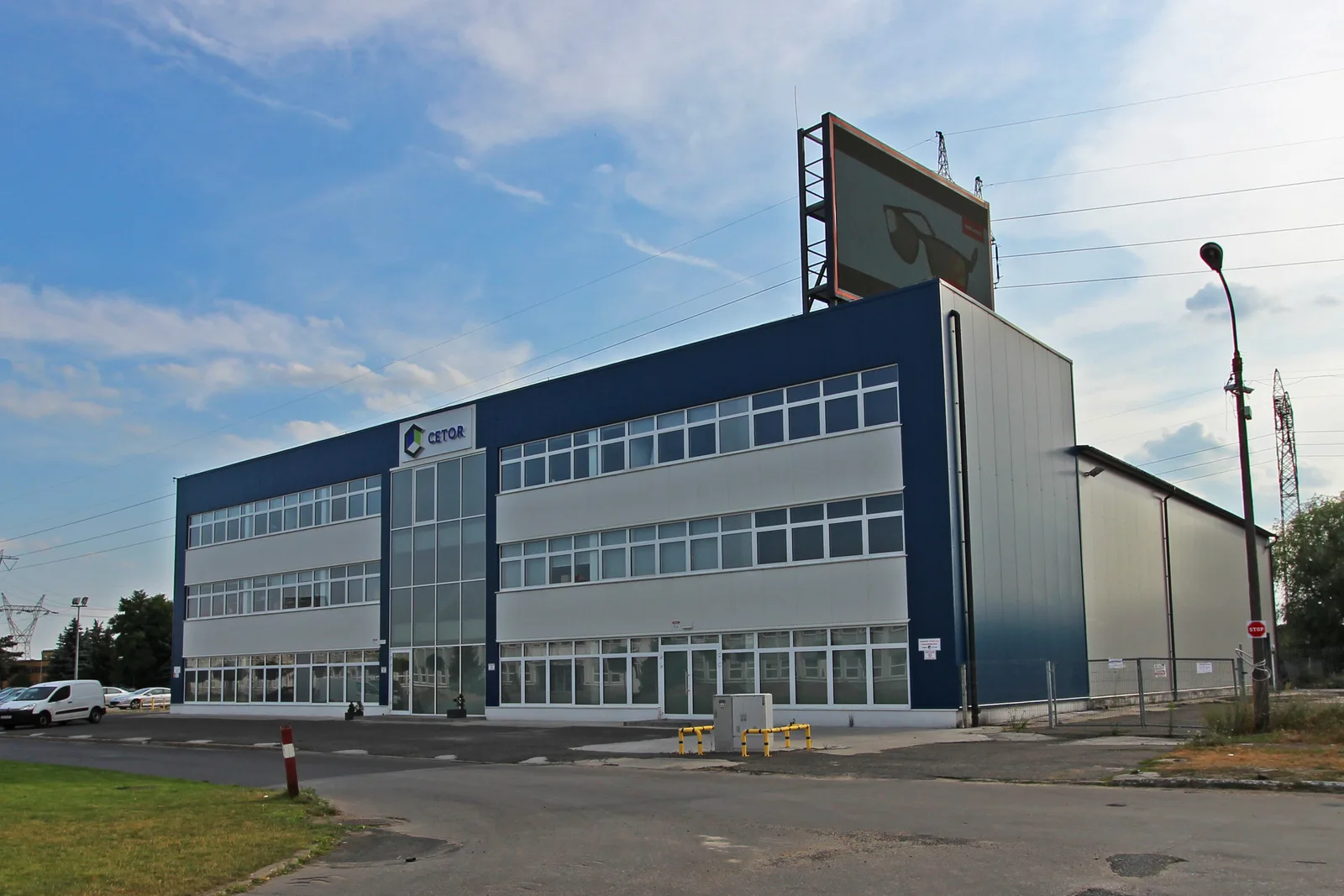 CETOR building exterior showing the renovated corporate facade with modern signage, demonstrating the complete exterior renovation scope of the project