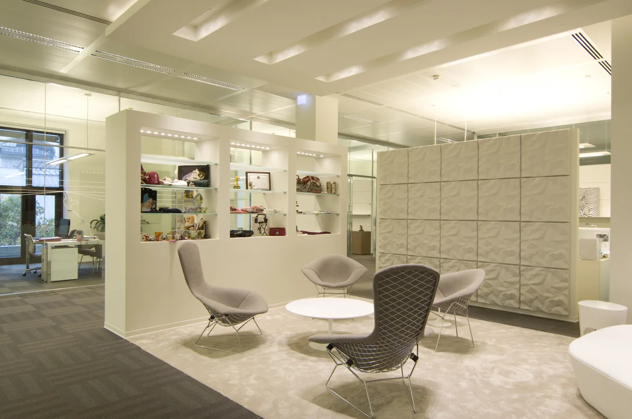 Level 3 executive awards display with Disney trophies and merchandise in purpose-designed illuminated architectural alcoves