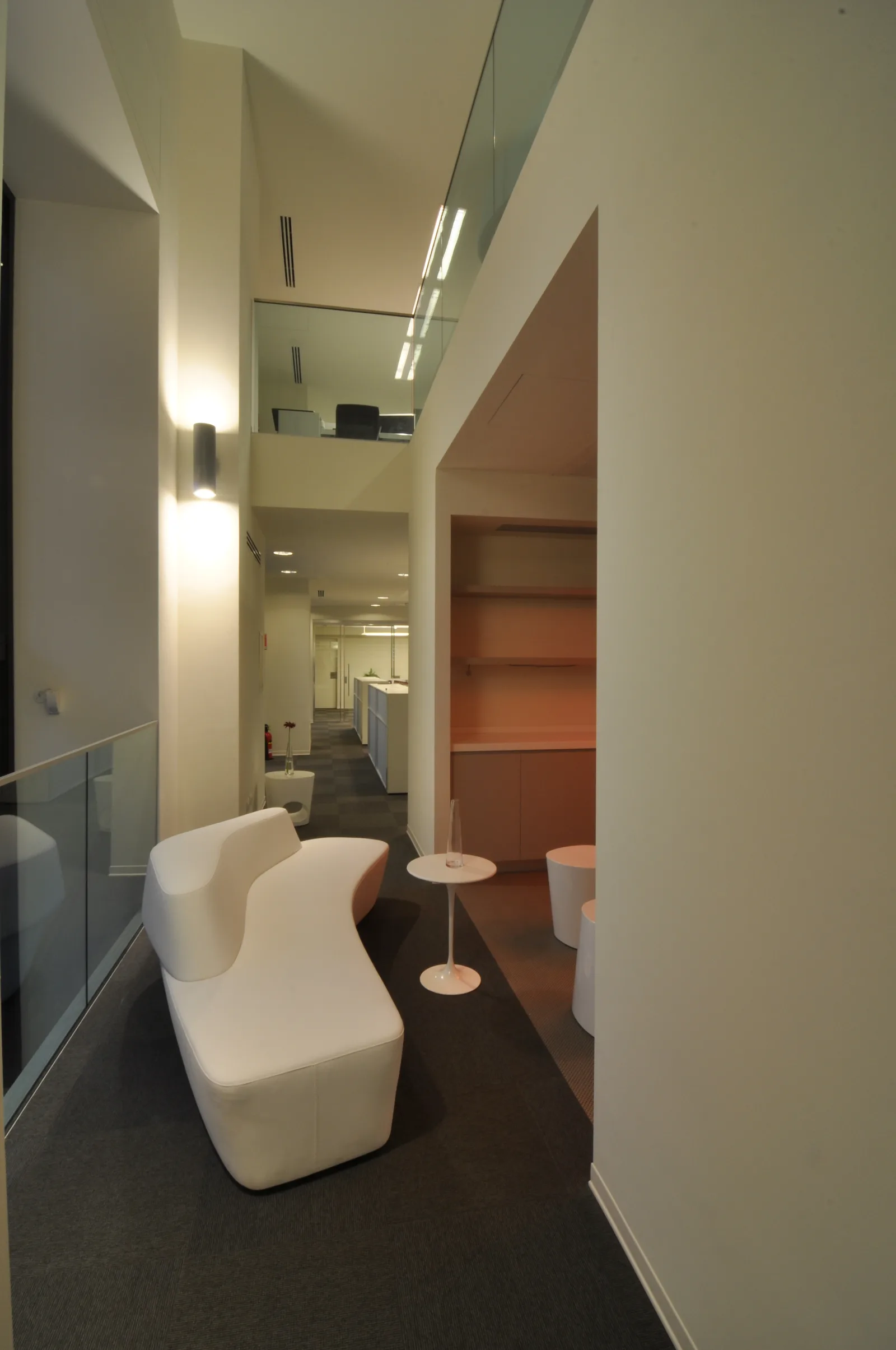 Ground floor material junction detail showing the meeting of Perle stone, Corian, and Grey Oak veneer surfaces