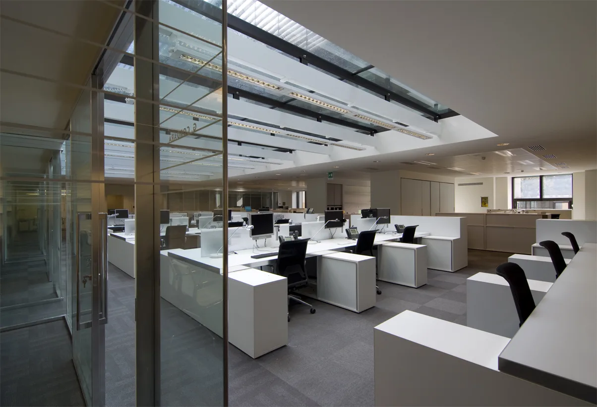 Ground floor view showing the Corian architectural volume from the entrance perspective with Perle stone flooring
