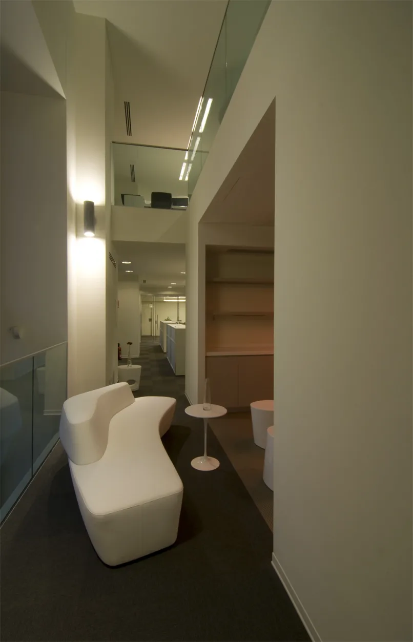 Ground floor wide view capturing the complete Corian architectural volume from reception through to the social zones