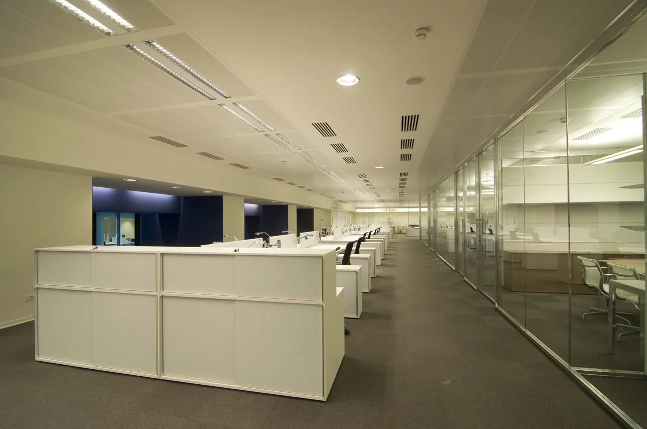 Level 1 workspace interior showing the open-plan layout with acoustic treatment and natural light