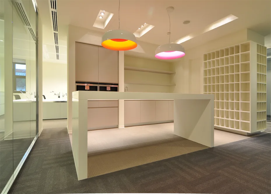 Level 4 workspace with the yellow floor colour identity and Artemide Skydro blue glow pendants