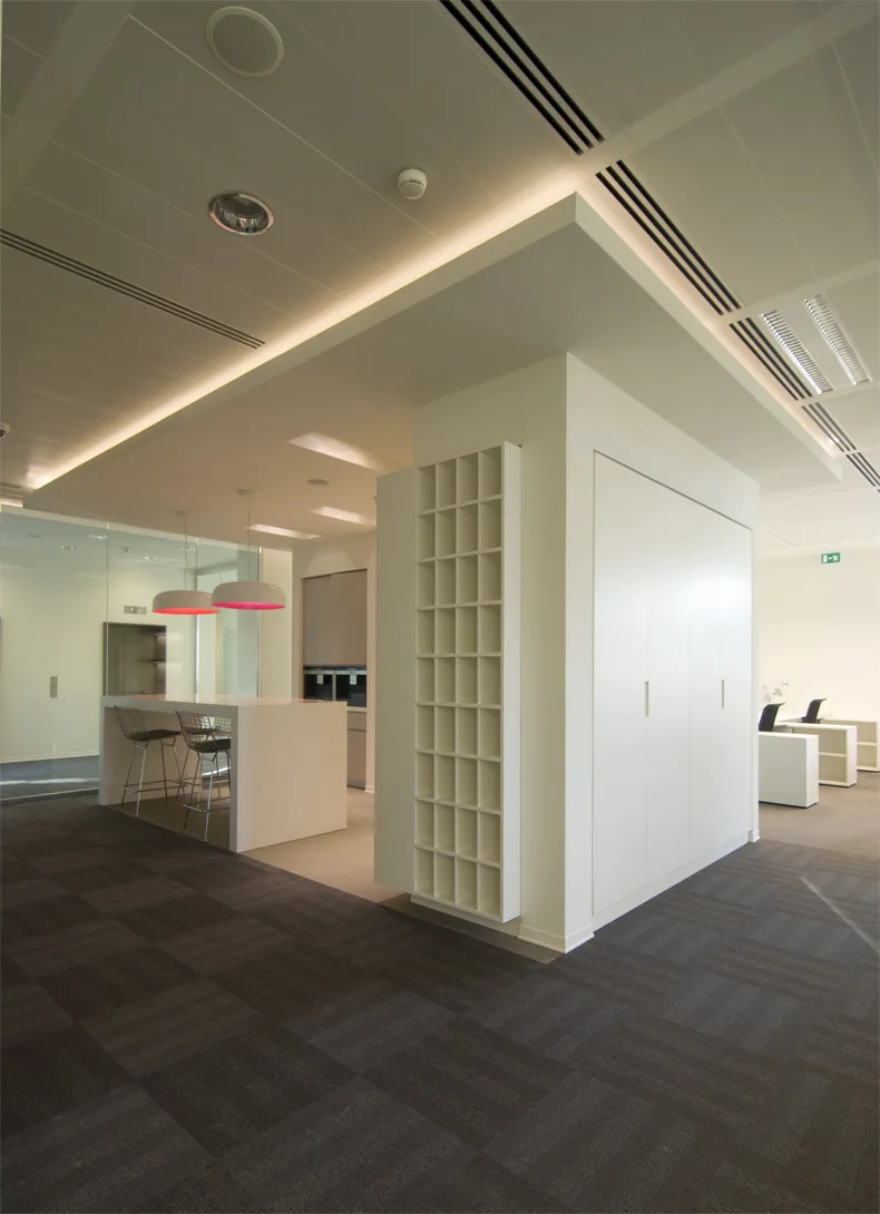 Level 4 meeting space interior with glass partitions and the floor's yellow identity accents
