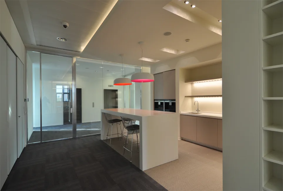 Level 4 workspace detail showing the woven vinyl flooring and acoustic treatment