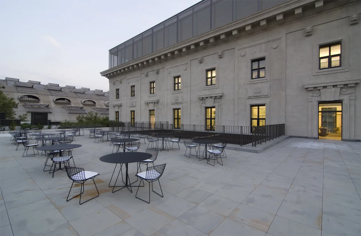 Terrace panoramic view showing the full outdoor social space with the heritage building backdrop