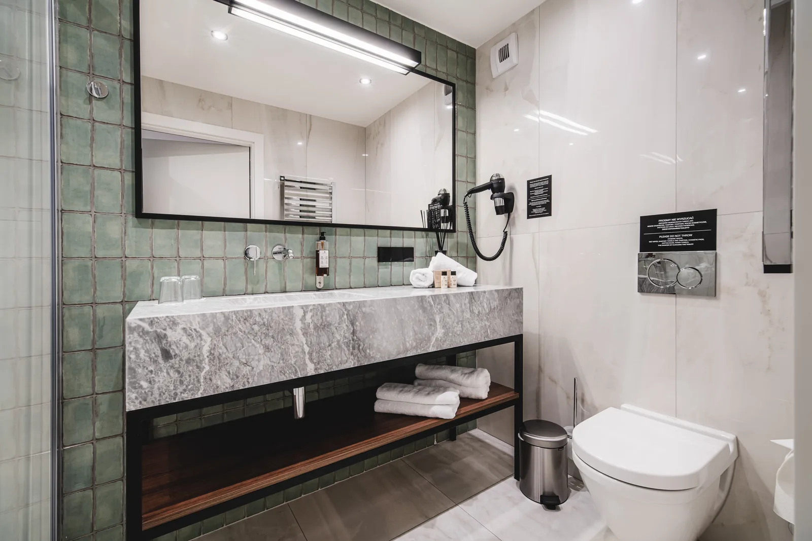 Wide bathroom view, marble vanity, green zellige tiles