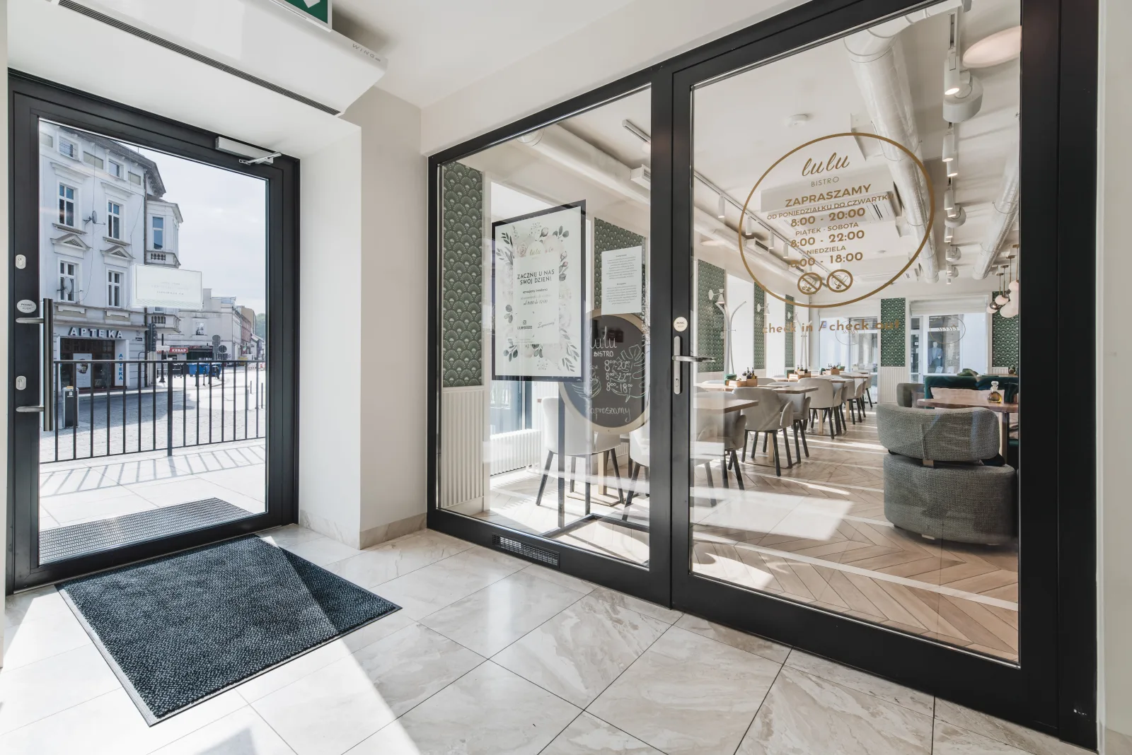 View through glass doors to street, ground floor lobby