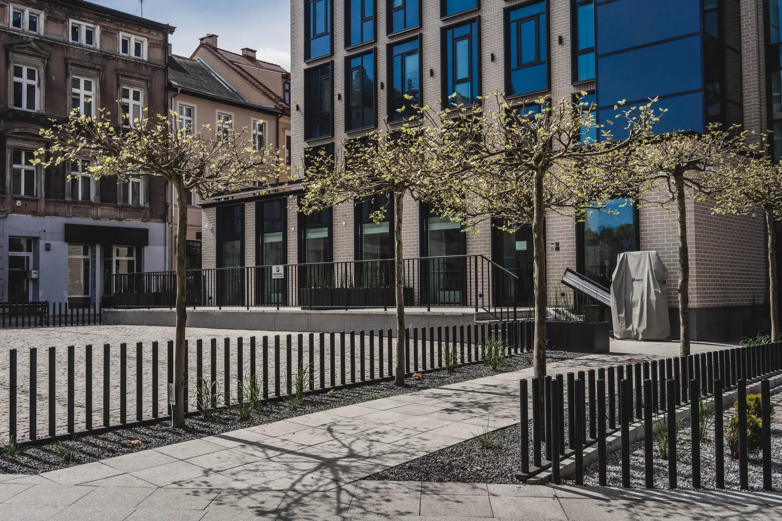 Sowa Apartments courtyard view from behind, green landscaping, rear facade