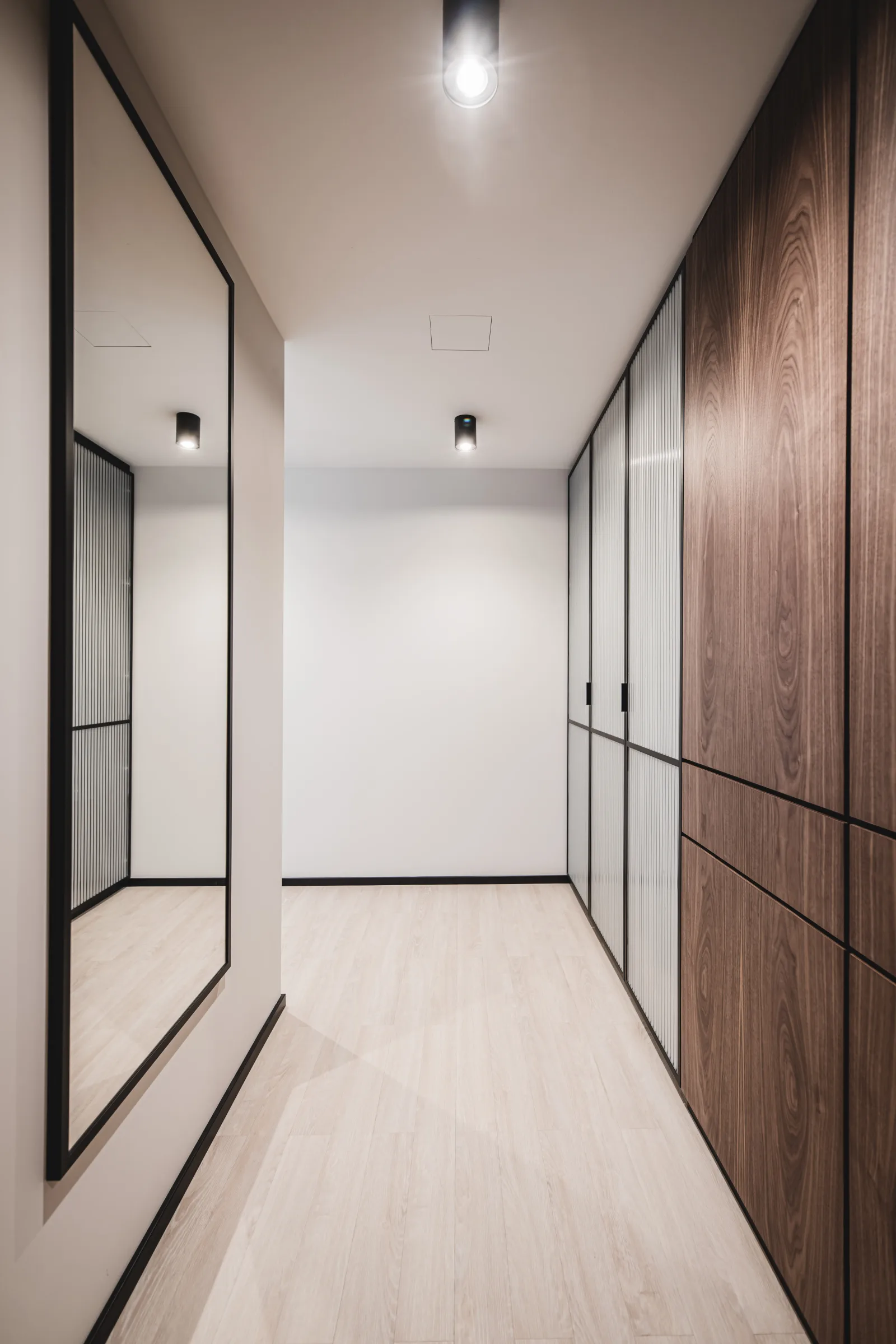 Hallway wardrobe corridor with built-in closet, walnut doors