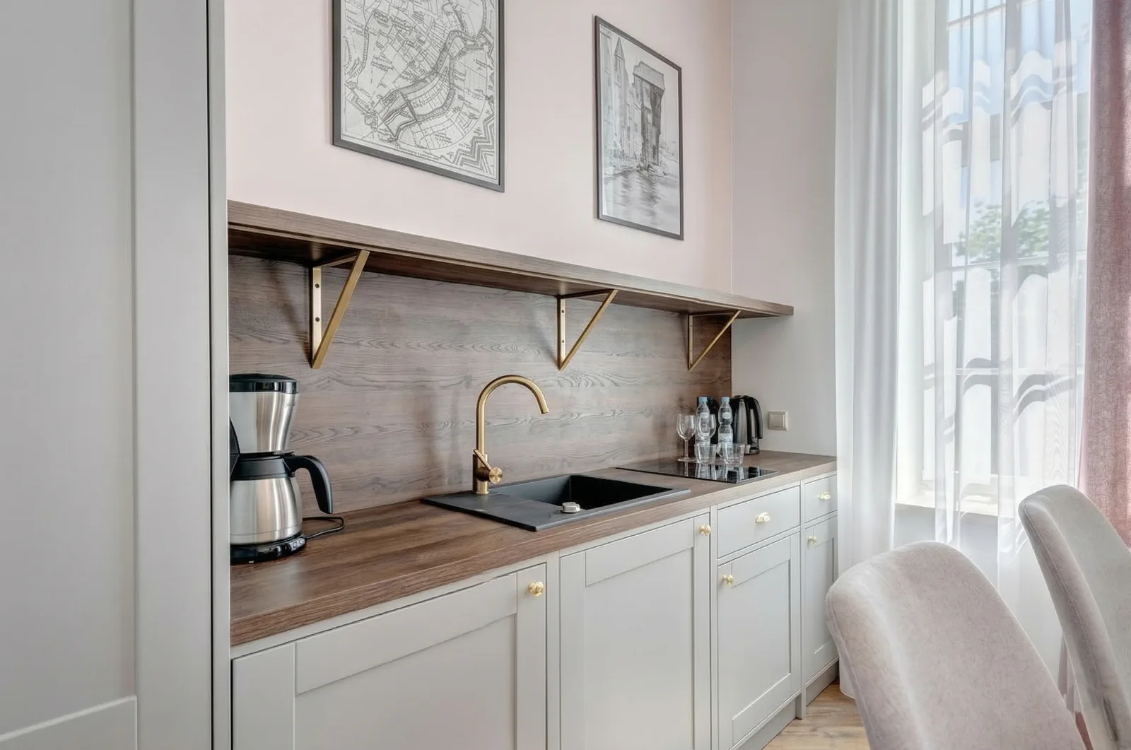 Counter area with wood paneling, warm lighting, and brass hardware details in the Sowa Gdansk interior