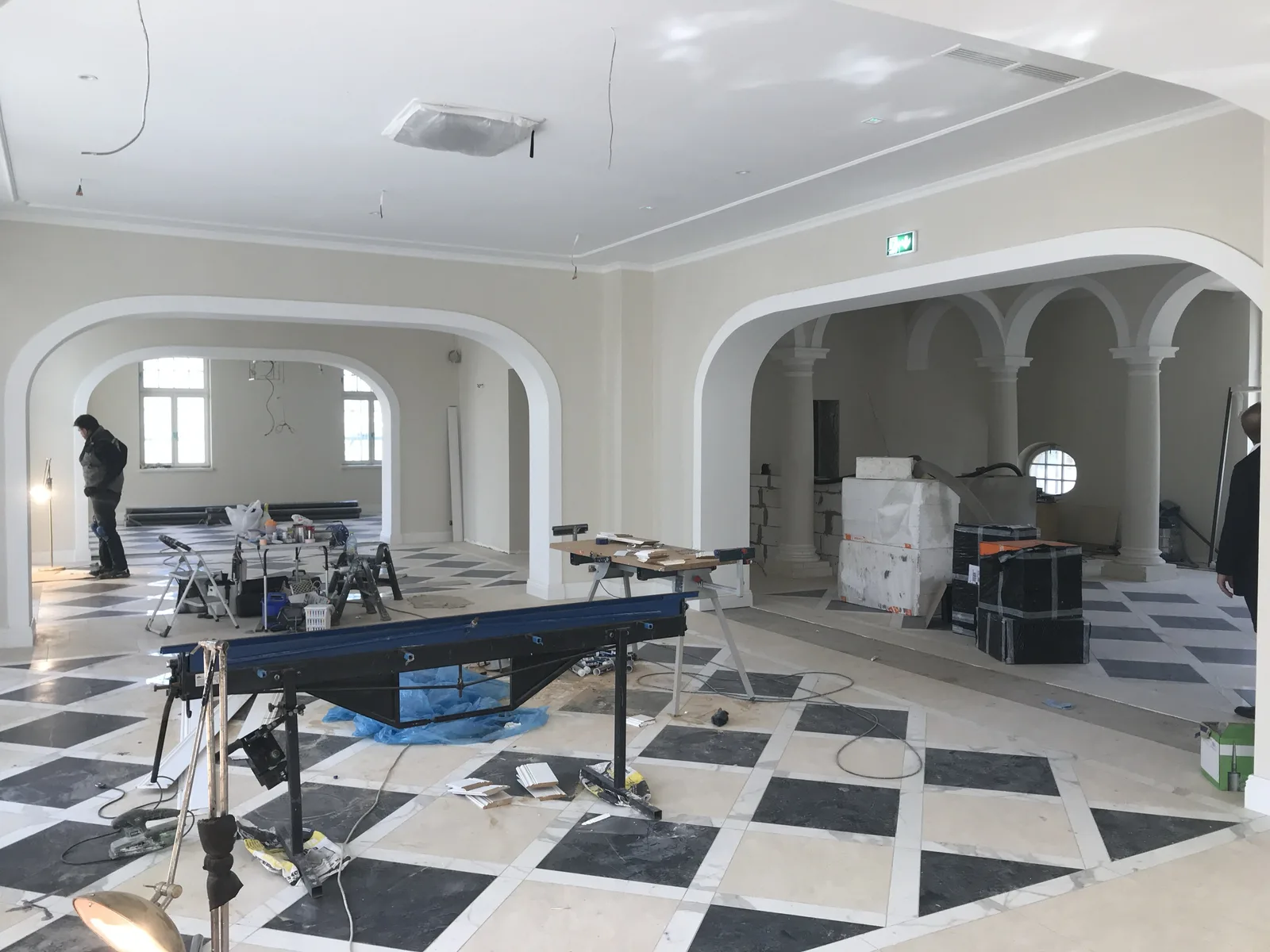 Palace construction progress showing interior framework and finishing stages