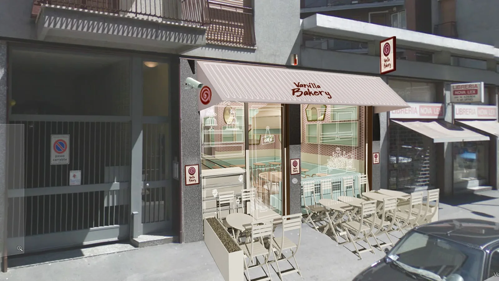 Exterior: angled three-quarter view of storefront with striped awning, glass display windows, outdoor seating with white chairs, surrounding architecture, street pavement, and trees