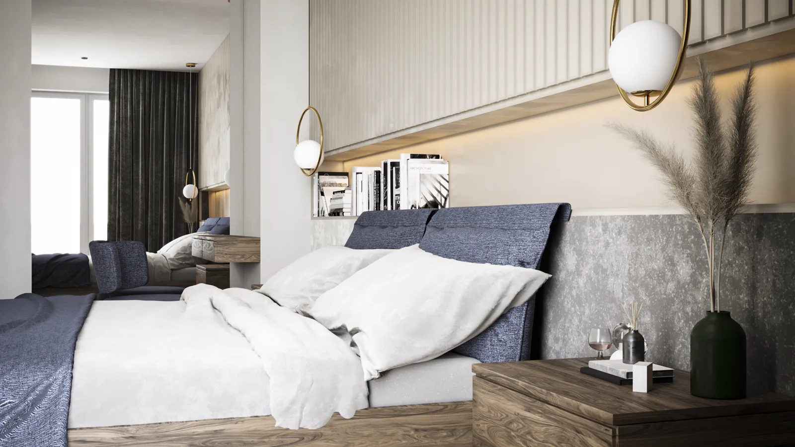 Master bedroom from foot of bed showing vanity mirror reflecting the room, walnut nightstand with pampas grass, denim blue bedding, and warm ambient lighting