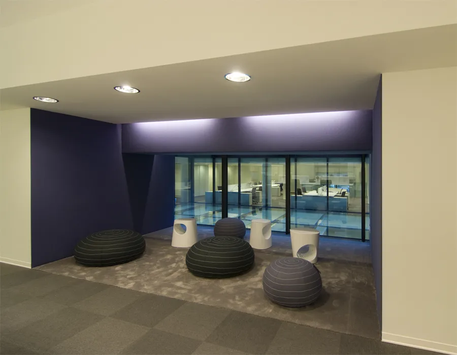 Level 1 open-plan workspace with purple accent colour identity and activity-based working destinations