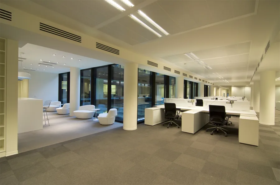 Level 1 workstation area showing the woven vinyl flooring and acoustic panel system