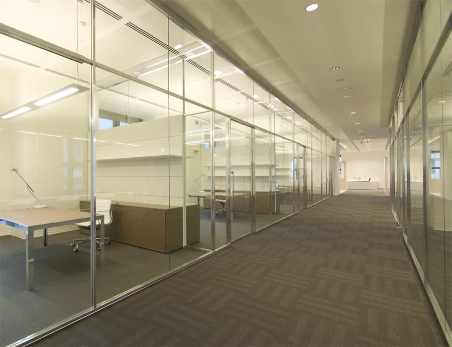 Level 3 corridor with glass-partitioned offices and the executive floor material palette