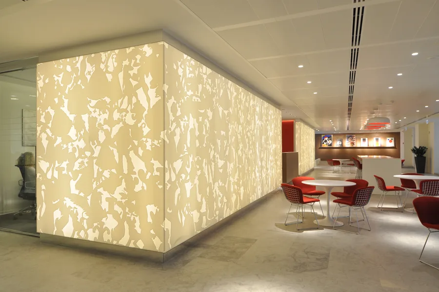 Lobby showing the Corian panels as a freestanding self-illuminated architectural box wrapping corners and defining spatial boundaries