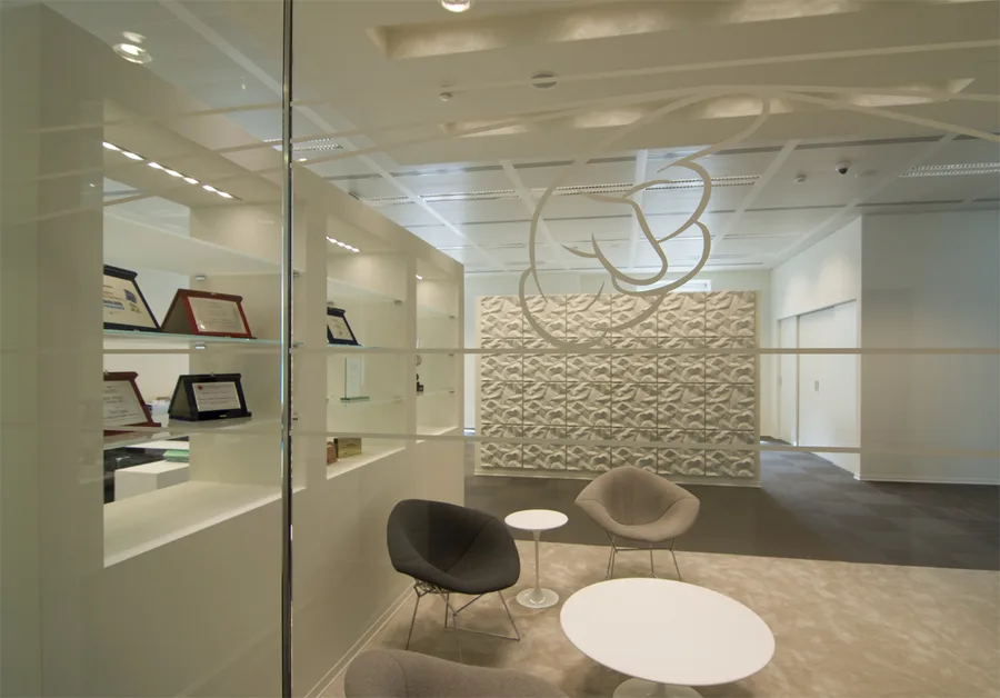 Level 3 executive zone with Disney character ceiling graphic by 45 Gradi, etched onto glass surface above the open-plan workspace
