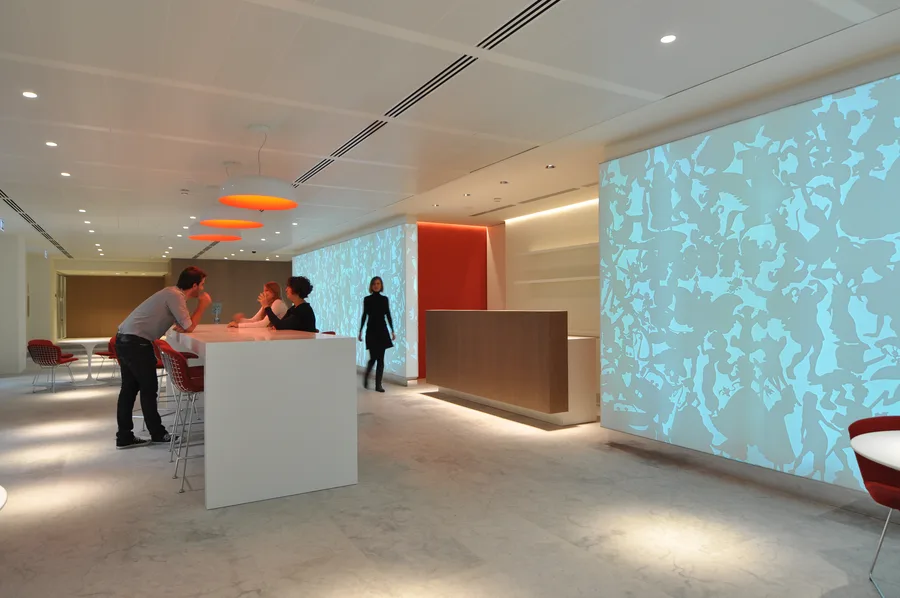 Professional interior photograph of the Disney headquarters ground floor, showcasing the spatial depth and material composition