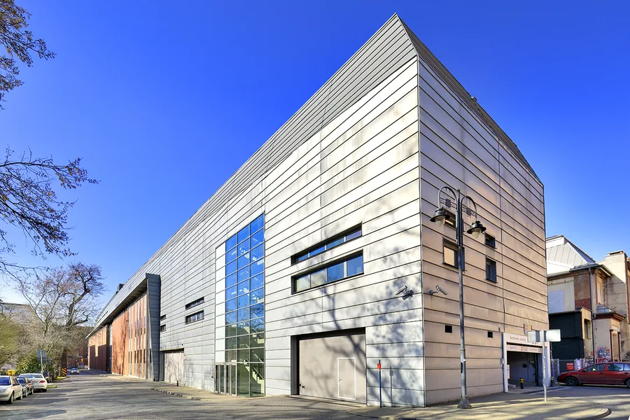 Exterior: professional photograph of Drukarnia shopping mall building facade at ul. Jagiellonska 1 in Bydgoszcz showing renewed commercial frontage and signage