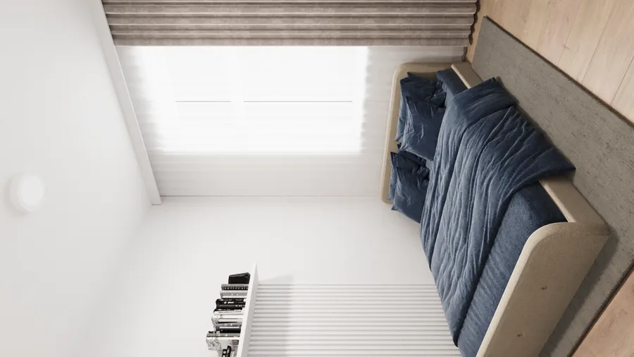 Gallery: rental studio bedroom corner with blue bedding, concrete-effect headboard panel, vinyl plank flooring, and wall-mounted shelf with books