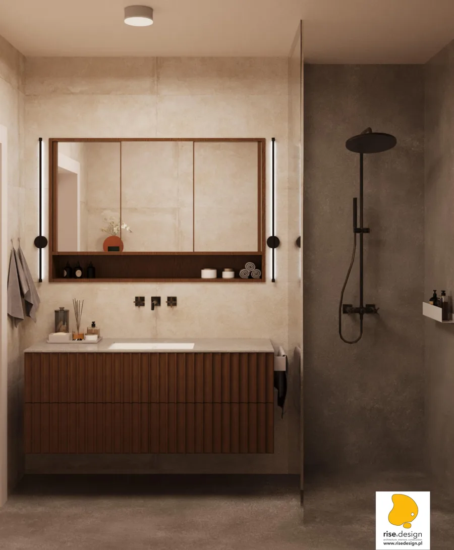 Gallery: bathroom with walnut ribbed vanity, Con.Crea cream stone wall tiles, glass walk-in shower with dark concrete-effect tiles, and black rainfall fixture